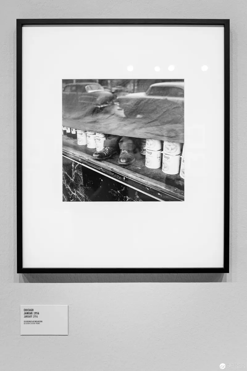 Industrial Barrels on Conveyor: Black and White Mechanical Landscape