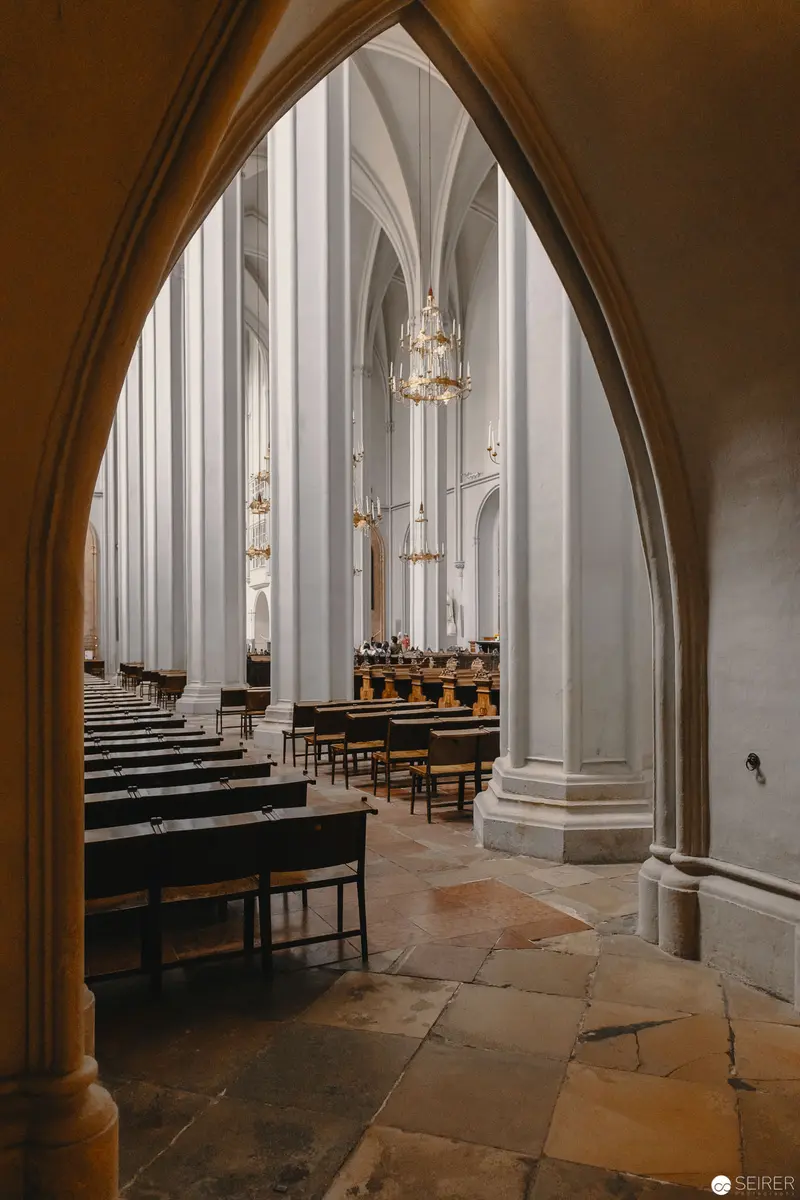 Gothic Church Interior with Arched Columns and Stone Floor