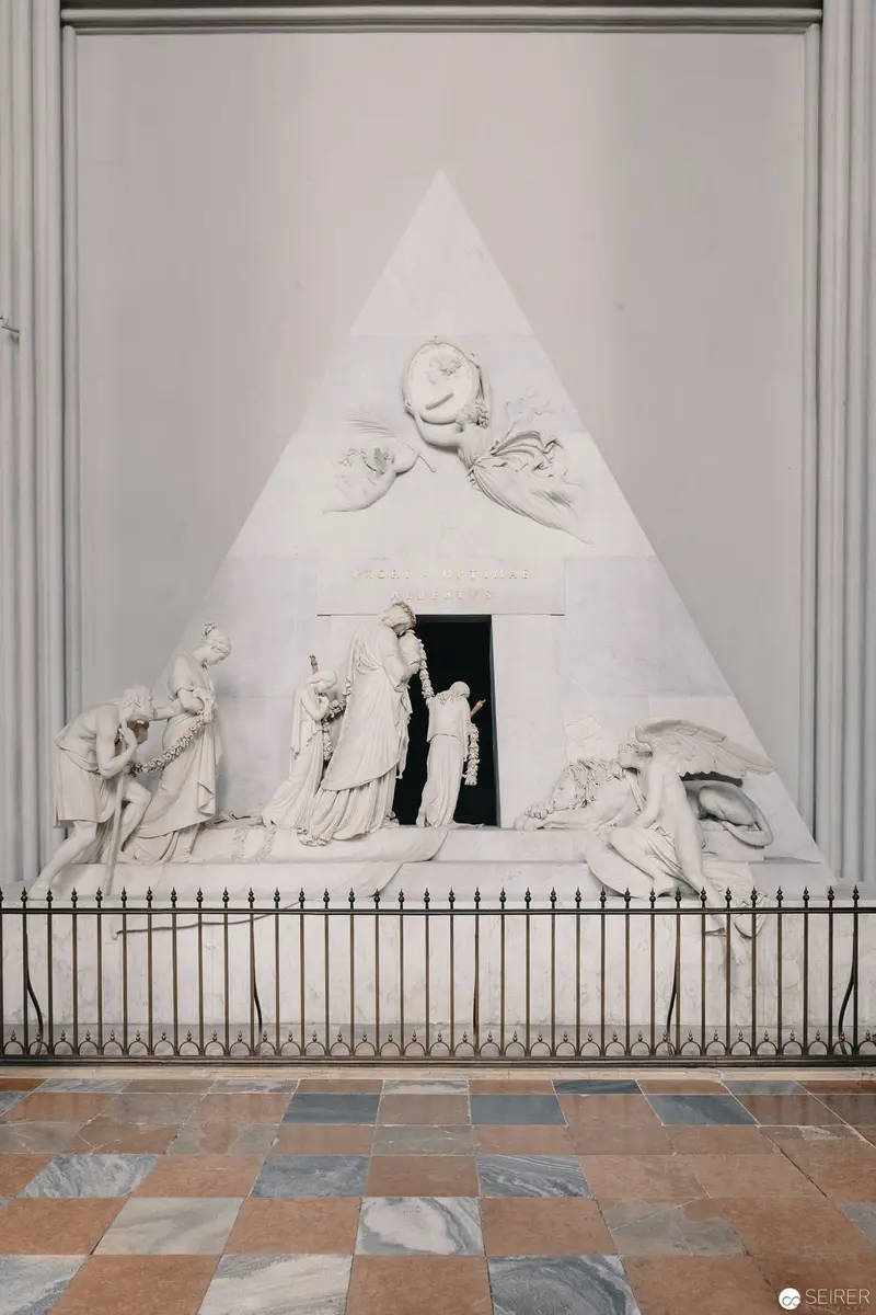 Neoclassical Sculptural Relief with Triangular Composition Behind Ornate Fence