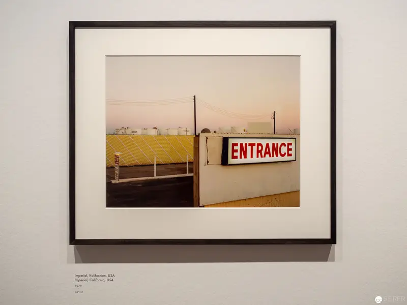 Industrial Landscape with Red Entrance Sign at Alfred Seiland Exhibition