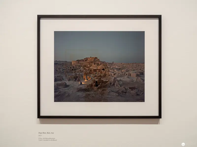 Ancient Settlement at Dusk: Architectural Landscape with Illuminated Structures