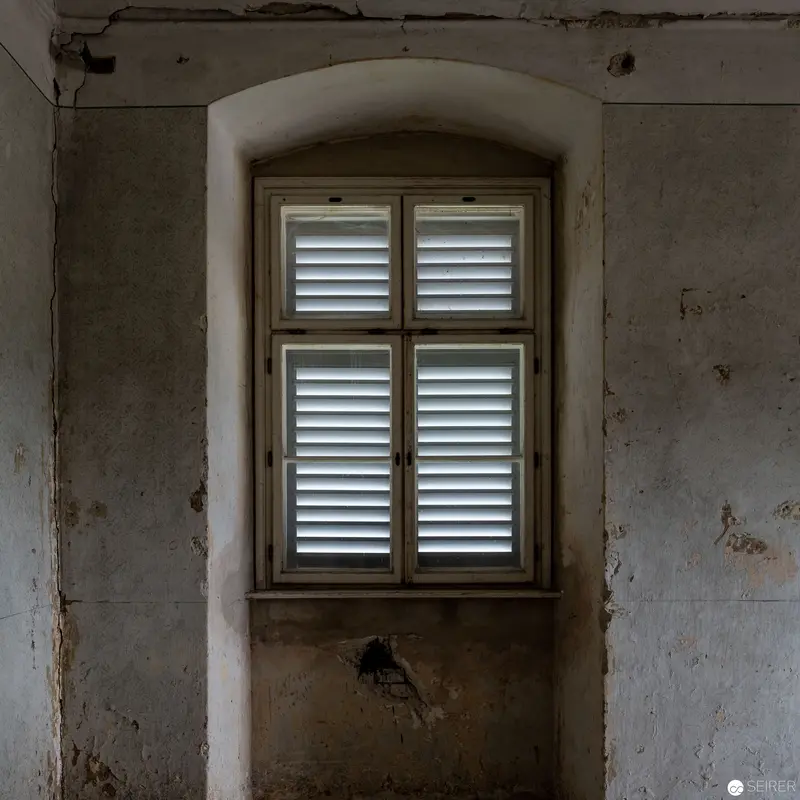 Weathered Interior with Shuttered Window in Decaying Architectural Space