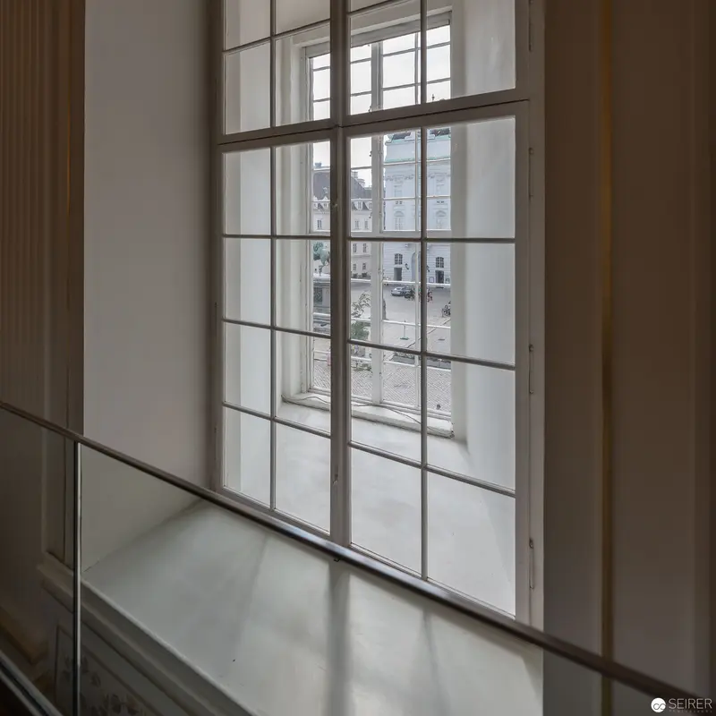 Large Modernist Window Overlooking Urban Architectural Landscape