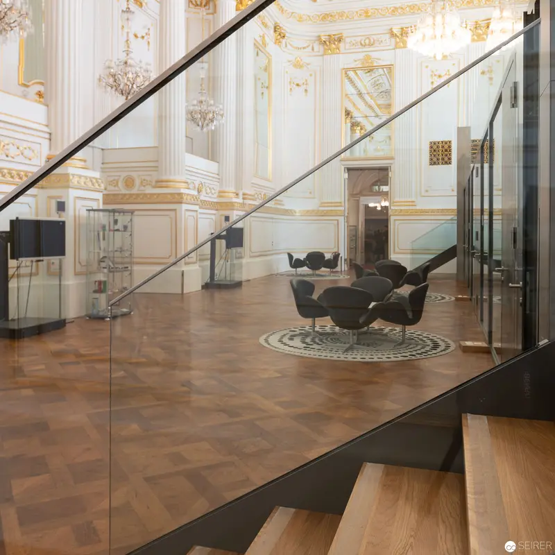 Modern Glass and Baroque Interior: Architectural Contrast in Ornate Palatial Space
