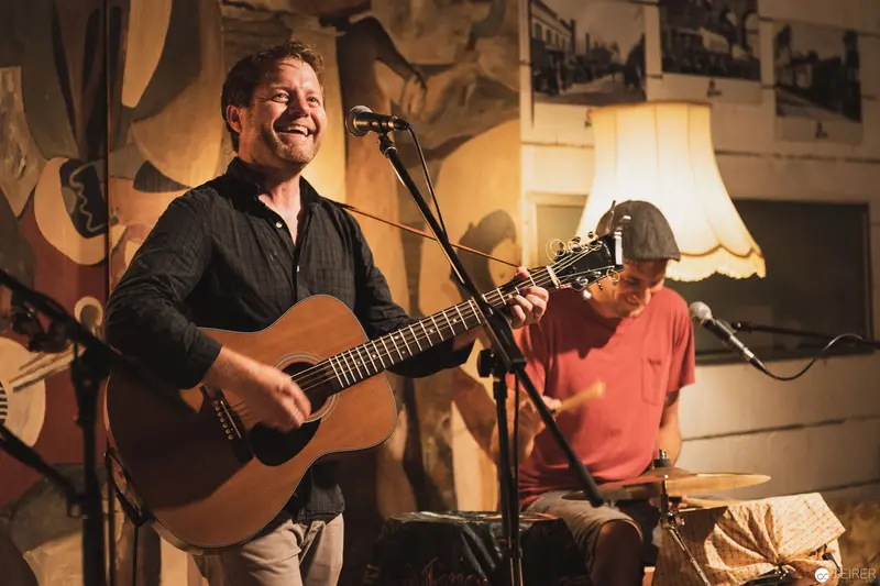 Acoustic Duo Performing Intimate Live Set with Guitar and Drums