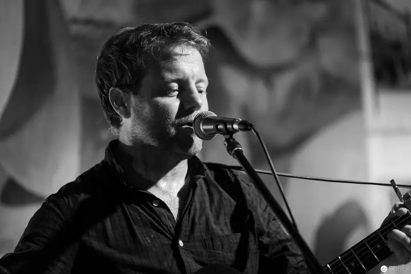Musician Performing Intensely in Black and White Concert Photography
