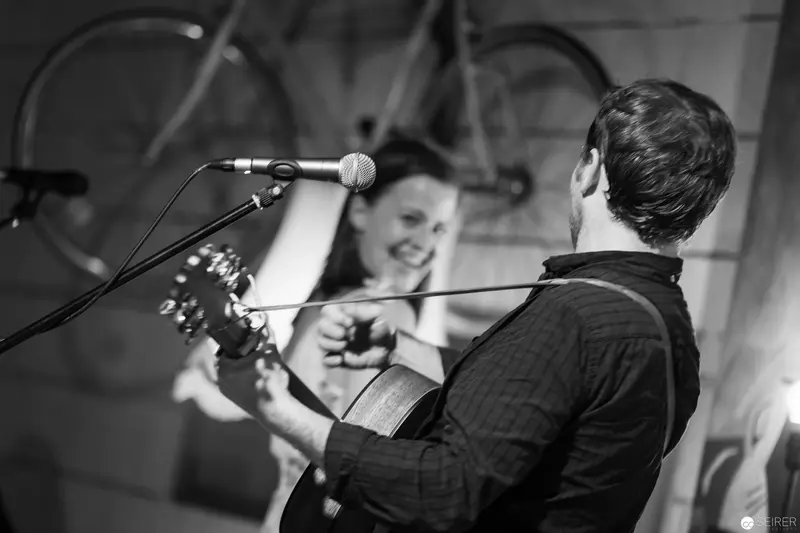 Acoustic Duo Performing Intimately in Black and White