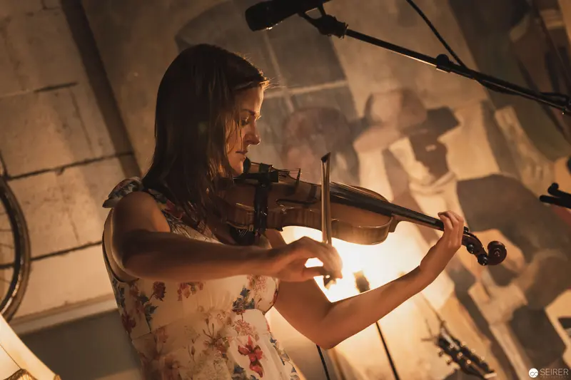 Violinist in Warm Amber Light Performing Intimate Acoustic Set