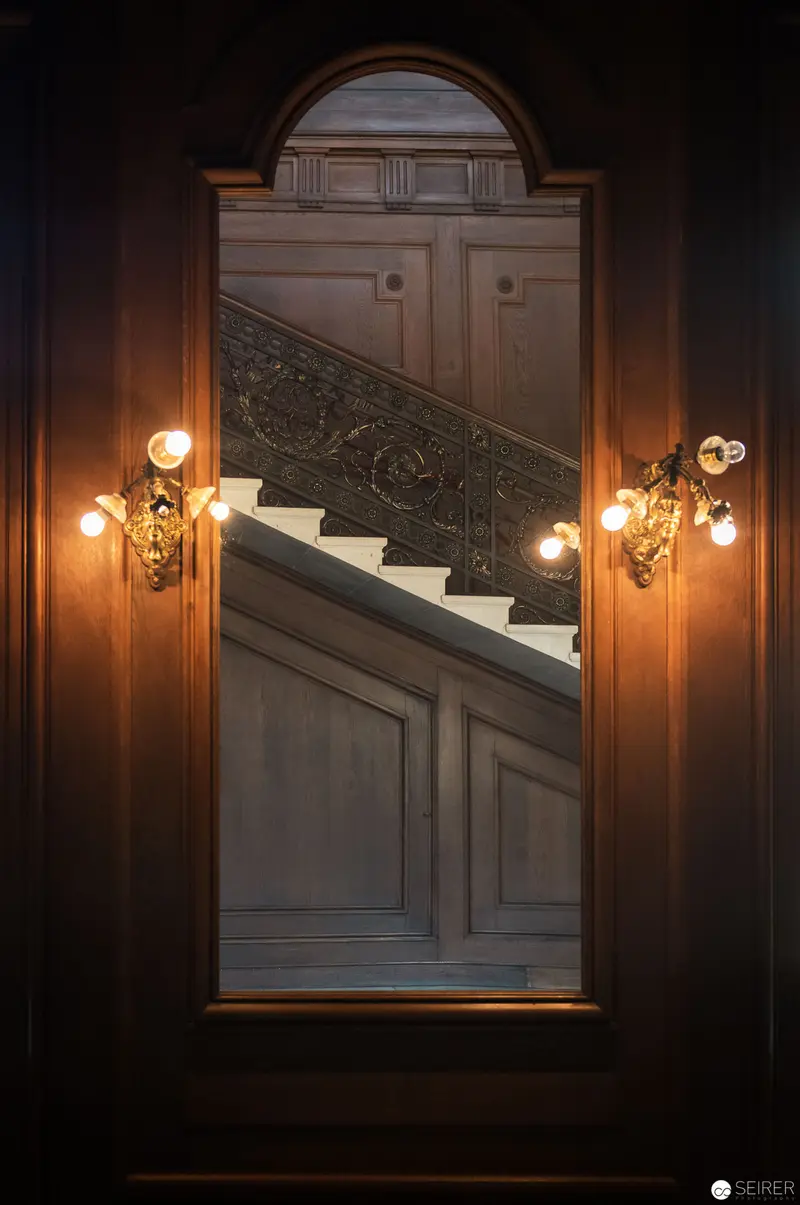 Interior Staircase at Hermesvilla with Ornate Lighting and Architectural Details