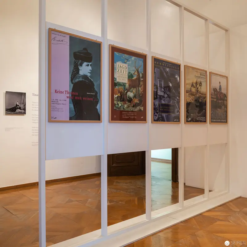 Hermesvilla Museum Exhibition: Vintage Poster Display on Historic Panels