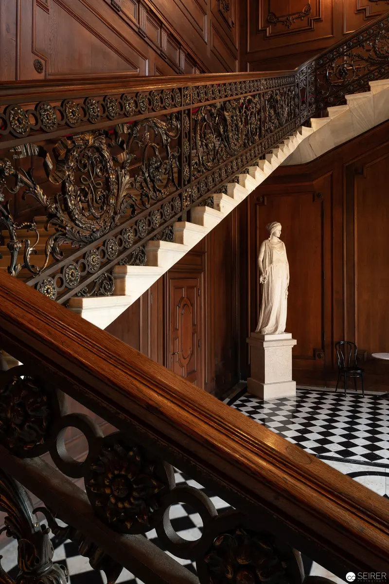 Ornate Interior of Hermesvilla, Vienna: Marble Statue on Checkered Floor Near Intricate Staircase