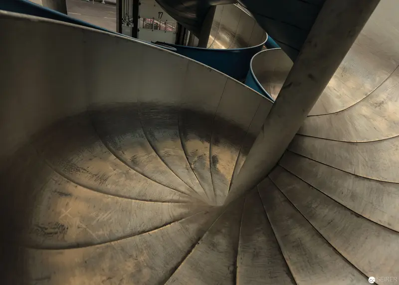 Spiral Concrete Staircase Revealing Architectural Geometry at Post City Linz