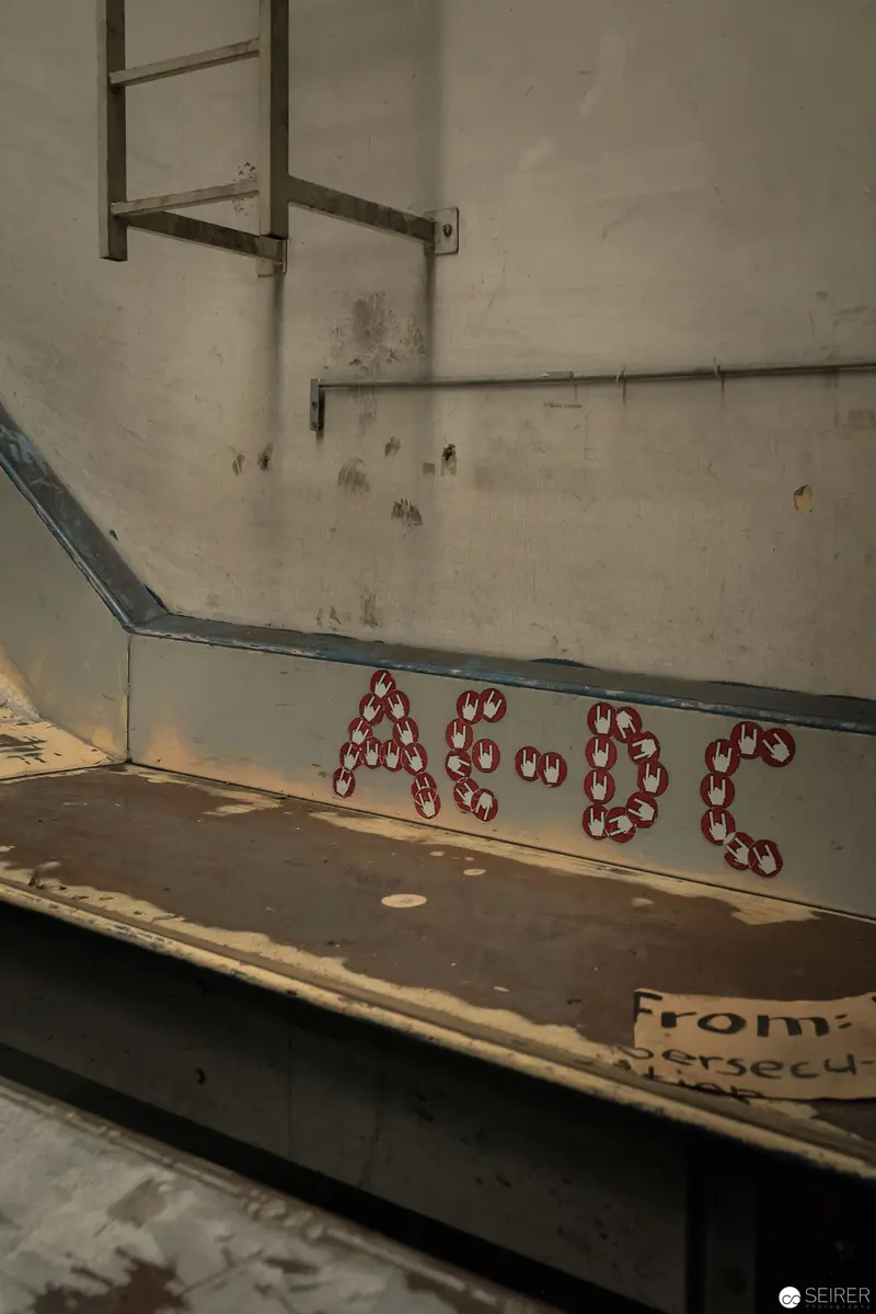 Graffiti Letters "AC-DC" on Industrial Wall Surface at Post City Linz