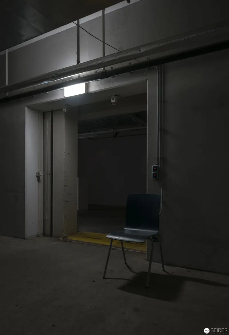 Minimalist Chair in Dark Hallway During Ars Electronica 2018 Preparations