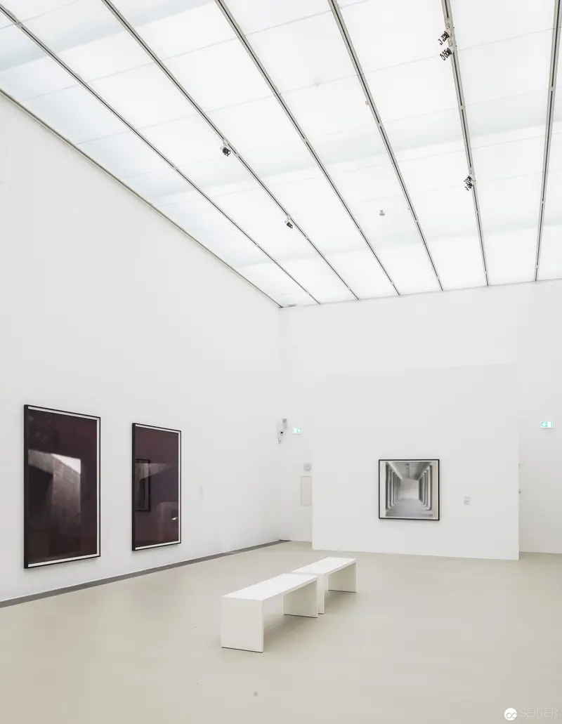 Eva Schlegel's "Spaces" Exhibition: Minimalist Gallery Interior with Suspended Artworks