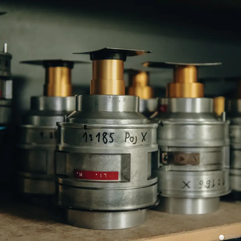 Industrial Precision: Vintage 70mm Film Canisters in Archival Storage