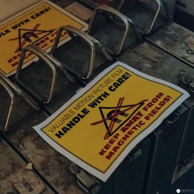 Warehouse Safety Warning Labels on Yellow Cautionary Signage