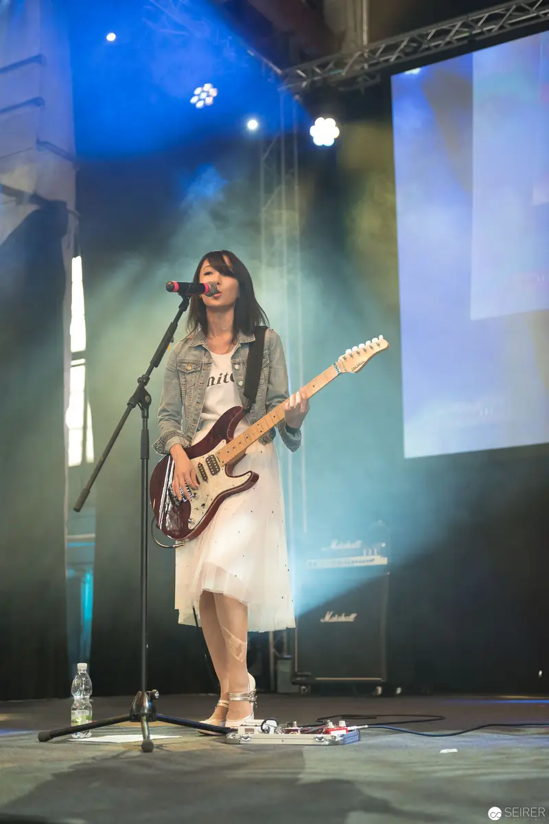 Haruka Performing at AniNite 2018 with Electric Guitar and Stage Lighting