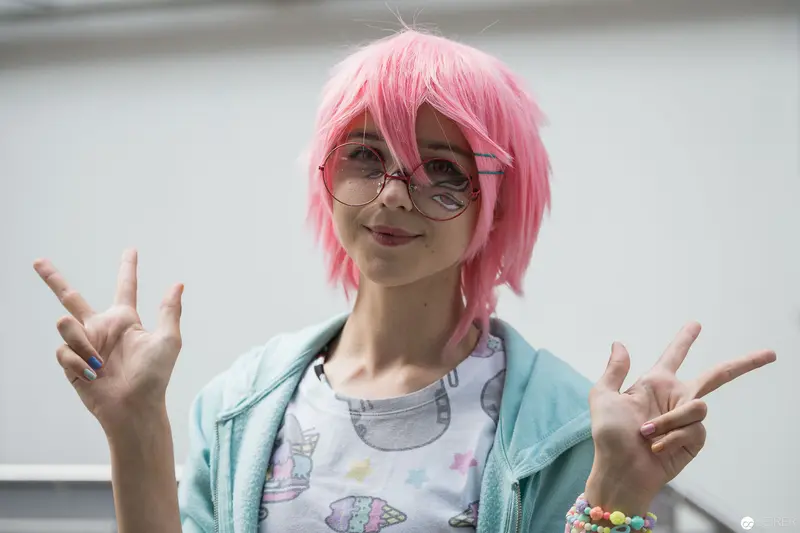 Pink-Haired Cosplayer Striking Rock Pose at AniNite 2018 Convention