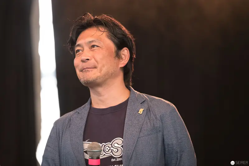 Takuya Taniguchi at AniNite 2018: Reflective Moment in Soft Lighting