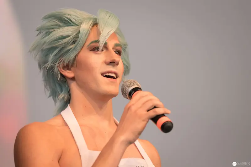 Blue-Haired Performer on Stage at AniNite 2018 Music Event