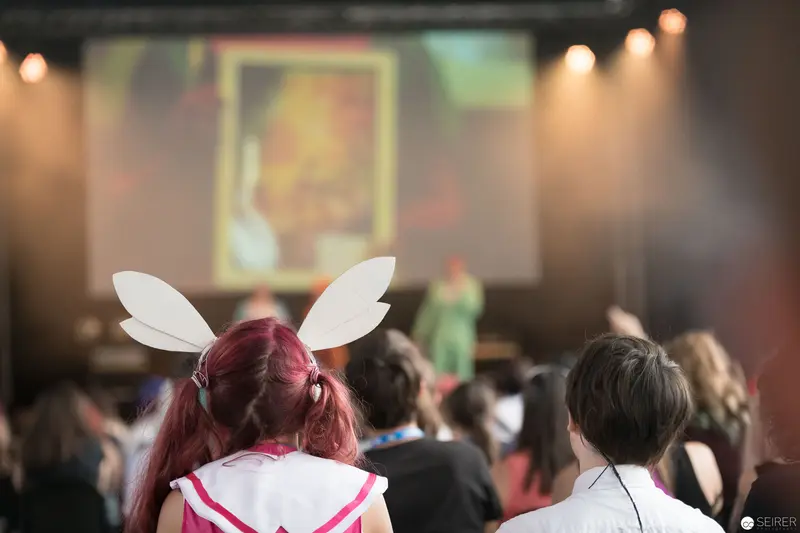 AniNite 2018: Cosplayer with Bunny Ears Attending Conference Presentation
