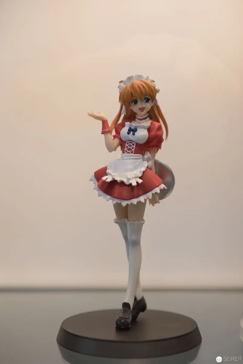 Anime-Style Maid Figurine on Display Pedestal in Soft-Lit Studio Setting