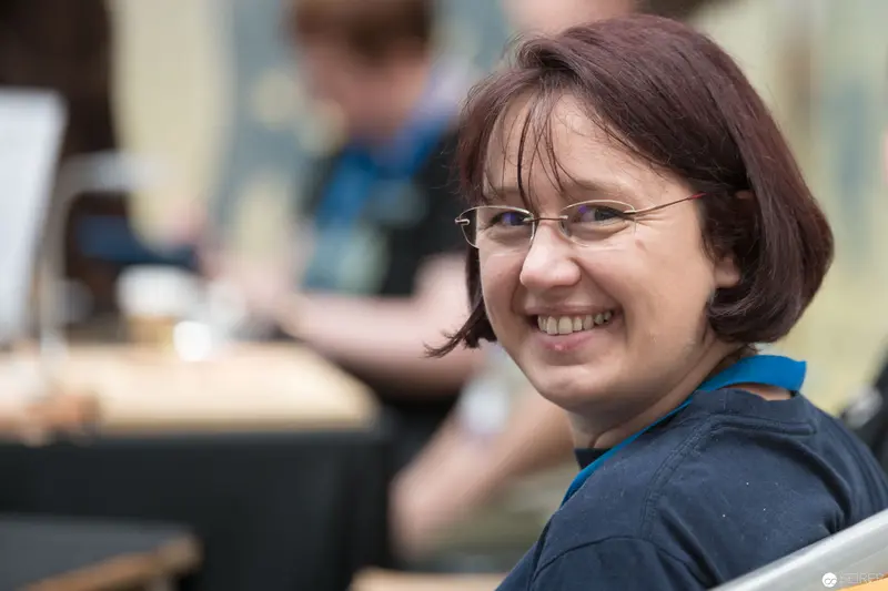Smiling Woman in Blue Top at AniNite 2018 Event