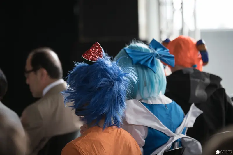 Costumed Attendees with Blue and Orange Hair at AniNite 2018 Convention
