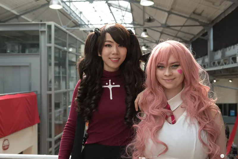 Two Cosplayers in Contrasting Styles at AniNite 2018 Convention