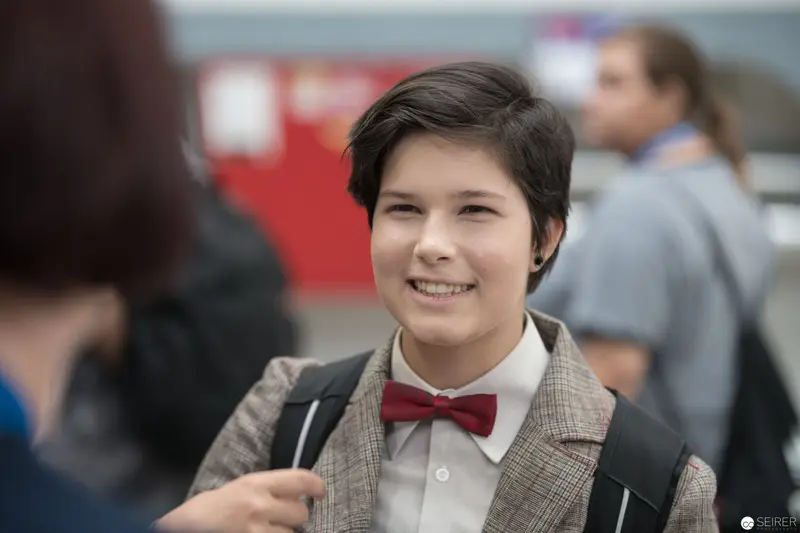 Young Student in Bowtie and Tweed Jacket at School Event