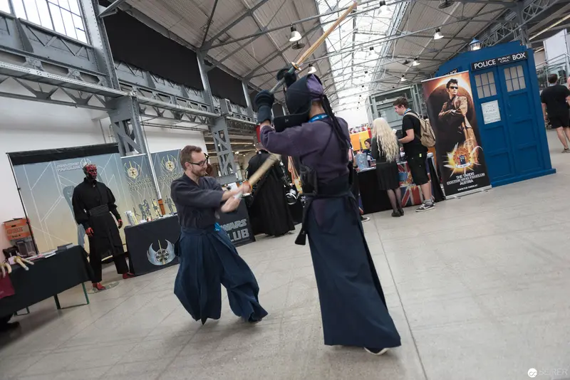 Two Practitioners Demonstrate Traditional Japanese Martial Arts Stance at Convention