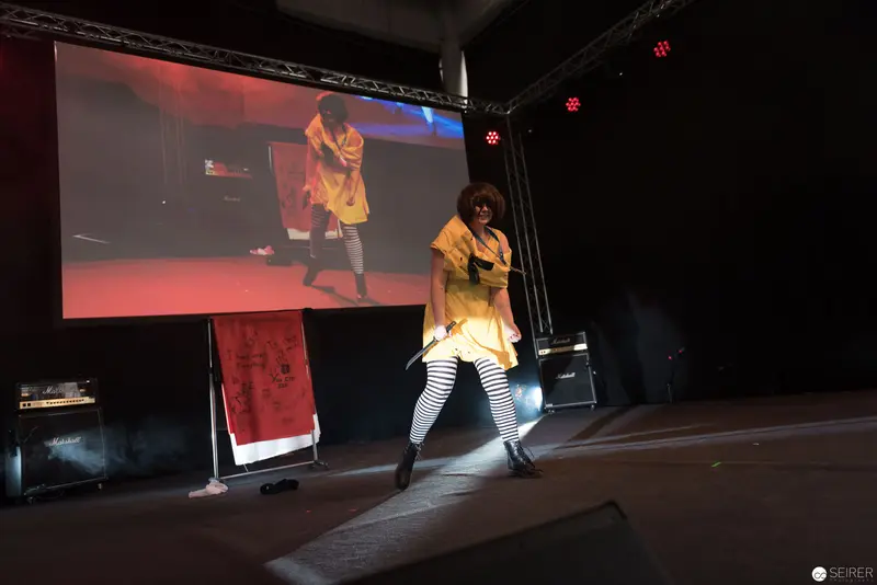 Performance Stage at AniNite 2018 with Dramatic Projection and Costumed Performer