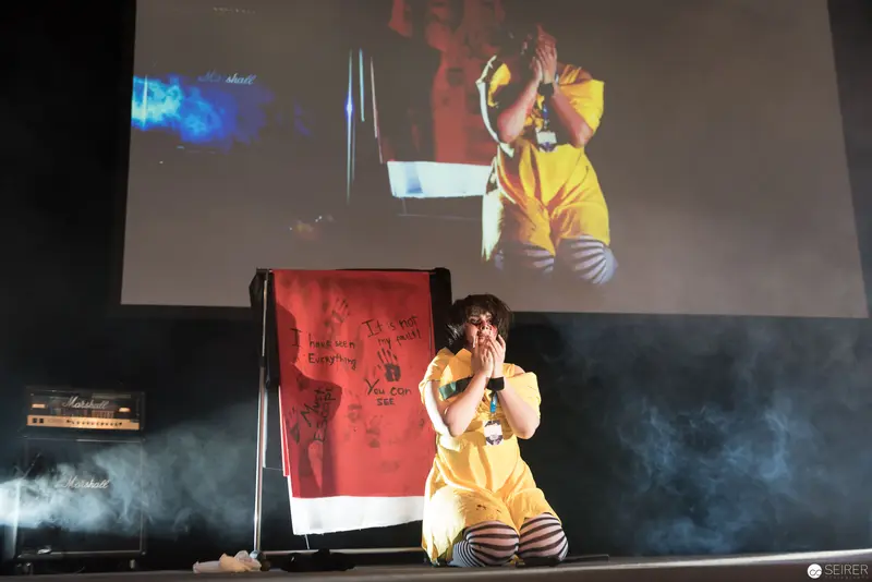 AniNite 2018: Performer in Yellow Dress on Smoky Stage with Projection