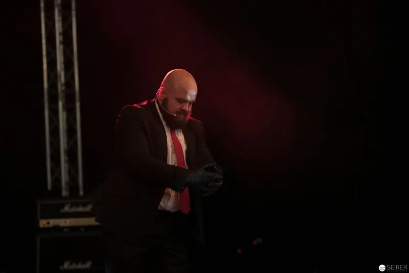 Intense Performer in Red Lighting at AniNite 2018 Musical Event