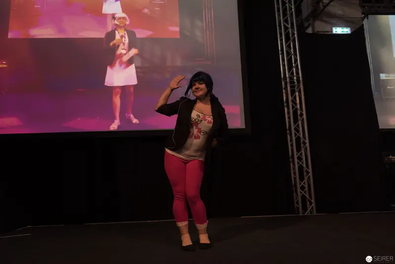 AniNite 2018: Performance Stage with Vocalist in Pink Pants and Backdrop Projection