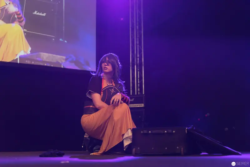 Haruka Performing on Stage at AniNite 2018 in Dramatic Purple Lighting