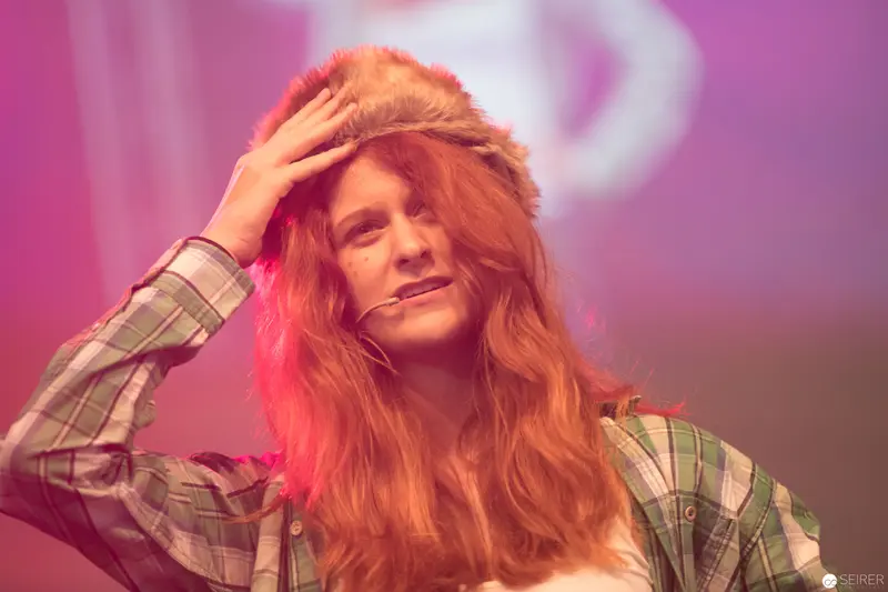 Performer in Plaid Shirt with Red Stage Lighting at AniNite 2018