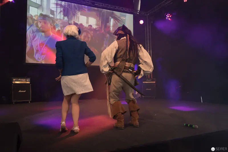 AniNite 2018: Costumed Performer and Presenter on Stage with Projection