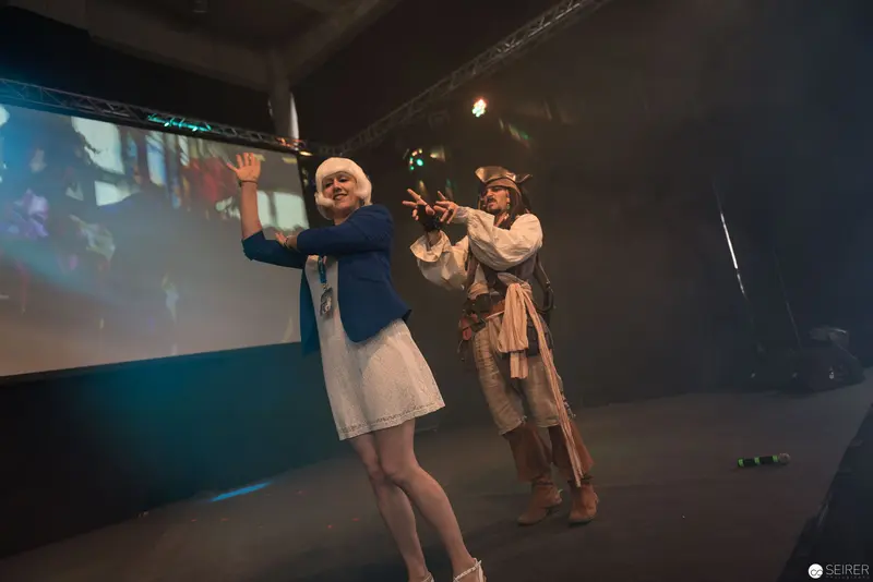 AniNite 2018 Performance: Theatrical Performers on Dimly Lit Stage with Projected Backdrop