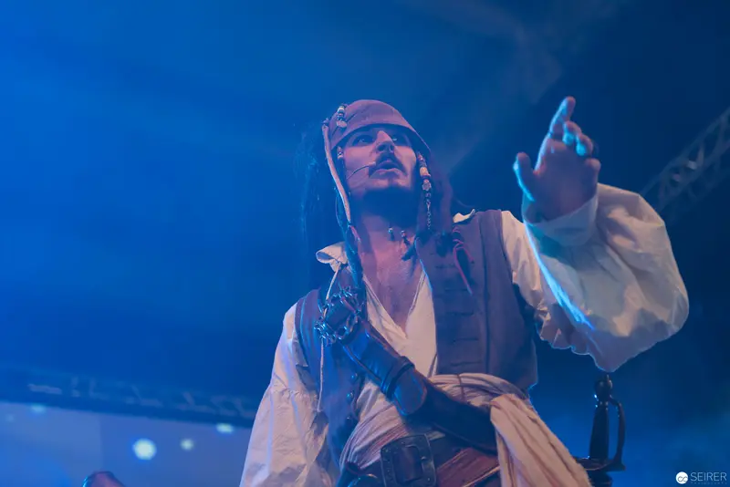 Performer in Theatrical Pirate Costume Under Blue Stage Lighting at AniNite 2018