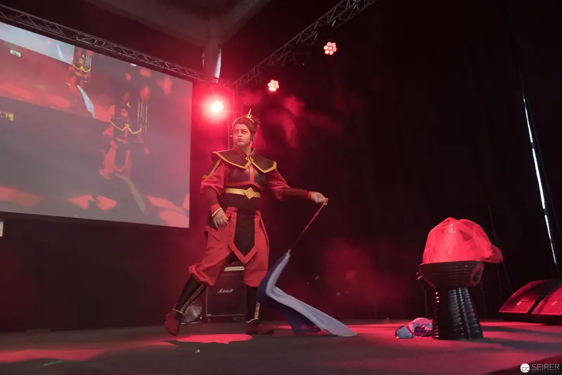 Cosplay Performance at AniNite 2018 Featuring Red-Clad Character on Stage
