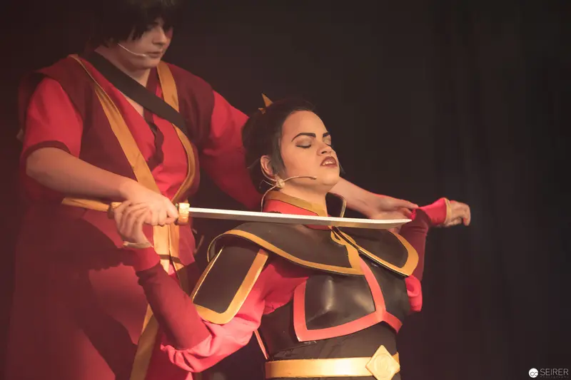 Cosplay Performance at AniNite 2018: Dramatic Sword Interaction in Red and Black