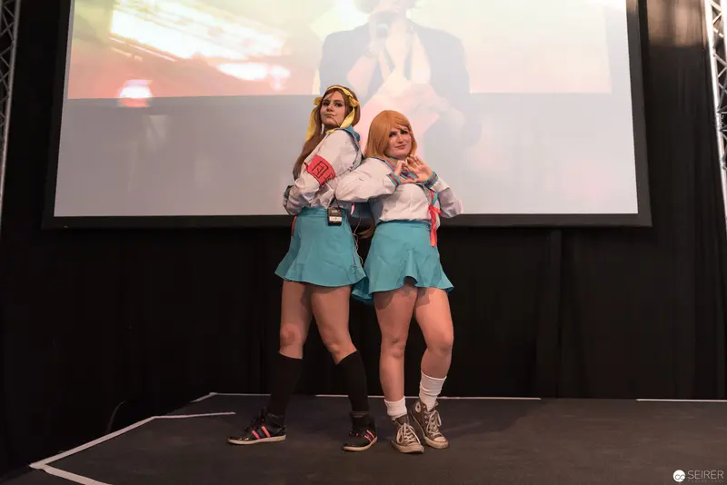 AniNite 2018 Cosplay Performance: Two Performers in Matching Blue Skirts on Stage