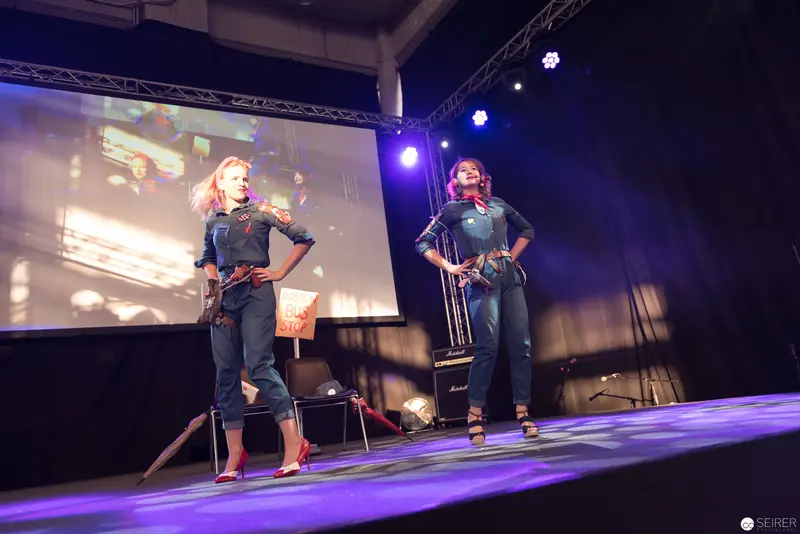 Performers on Stage at AniNite 2018 Music Event in Dynamic Pose