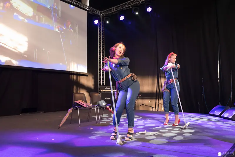 Two Performers on Stage with Scooters at AniNite 2018 Performance Event
