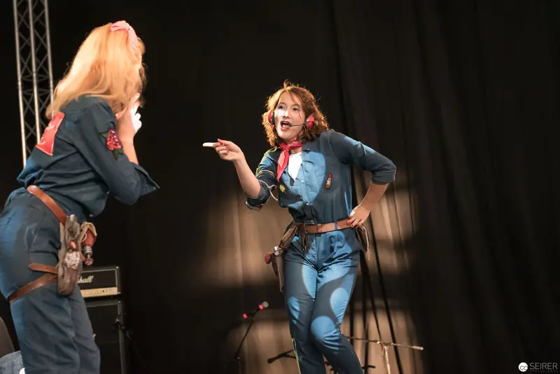 AniNite 2018: Two Performers in Denim Stage Costumes Engaging Dramatically