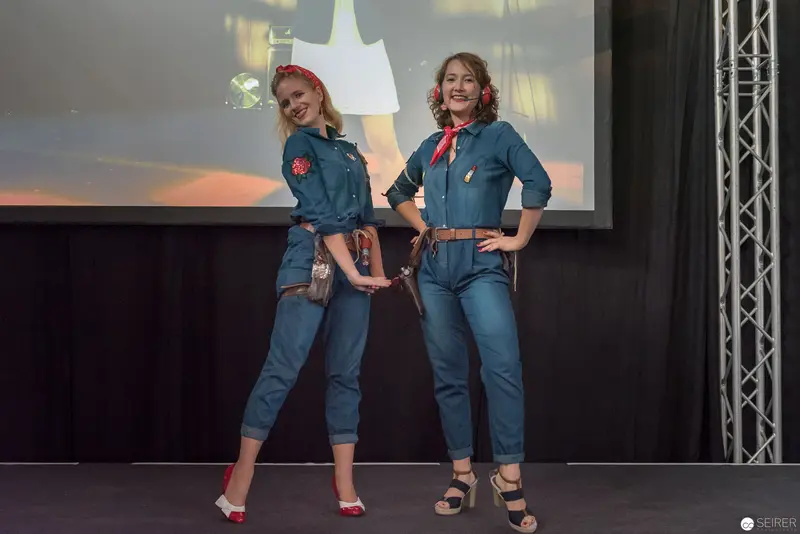 Two Women in Denim and Red Accessories at AniNite 2018 Performance Event
