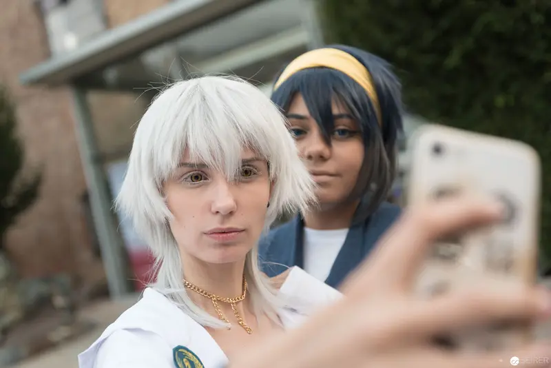 Cosplay Duo Posing with Smartphone at AniNite 2018 Anime Convention