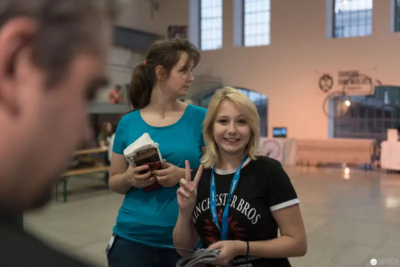 Two Attendees at AniNite 2018 Event Sharing a Moment of Camaraderie